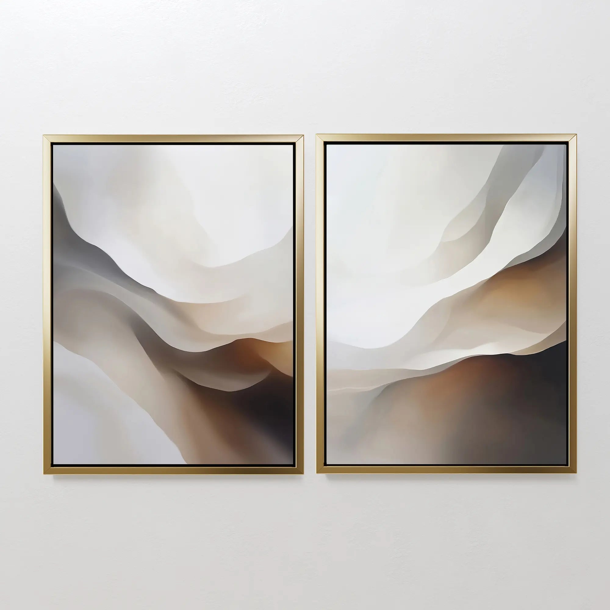 The Smooth Flow Set of 2 features abstract wall art with soft shapes in white, beige, brown, and gray, framed by thin gold borders—ideal as modern or neutral wall decor for a clean white wall.