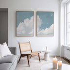 A living room with a couch and chair, enhanced by the Soaring Peace Set of 2 wall art prints, for a cozy and inviting atmosphere.