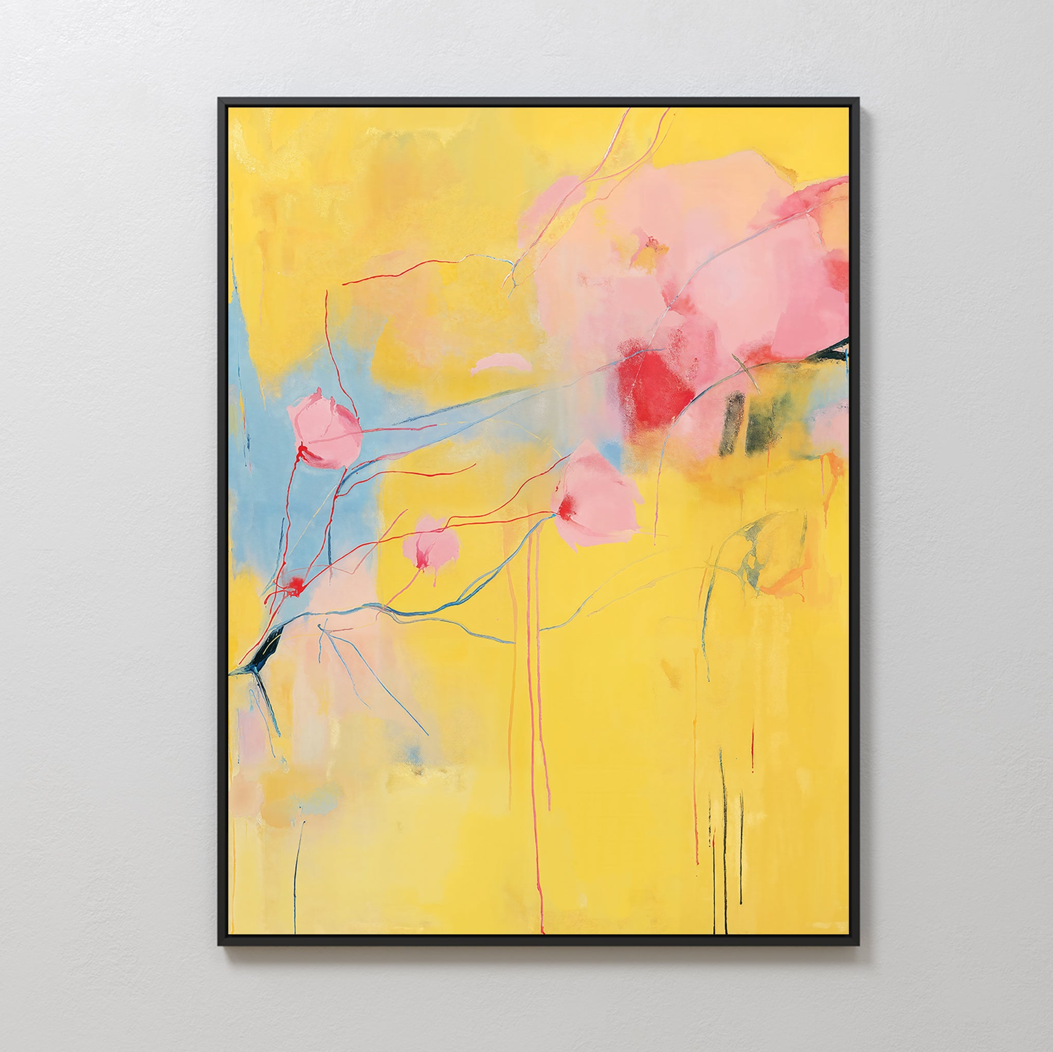 Soft Bloom Abstract Canvas Art features a bright yellow background with pink and red shapes, blue accents, and flowing lines. This large, framed piece adds vibrant style to living room decor and looks stunning on light-colored walls.