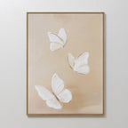 The Linen Wings Canvas Art features three delicate white butterflies on a soft beige background, inspired by Nordic Park. This elegant wall decor adds a calm, airy touch to any space.