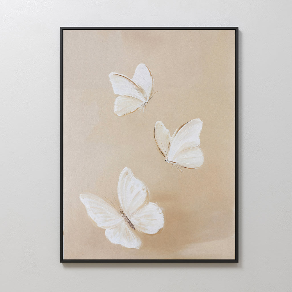 Linen Wings Canvas Art showcases three white butterflies with delicate wings on a soft beige backdrop—an elegant framed wall decor perfect for Nordic Park-inspired spaces.