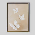 Linen Wings Canvas Art features three delicate white butterflies with light brown accents on a soft beige background, offering minimalistic elegance—perfect refined decor for any wall.