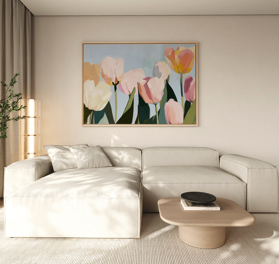 A modern living room with a light beige sectional, a low wooden coffee table, and the Soft Field Canvas Art above the sofa. Soft natural light filters through sheer curtains, highlighting this vibrant large wall art.