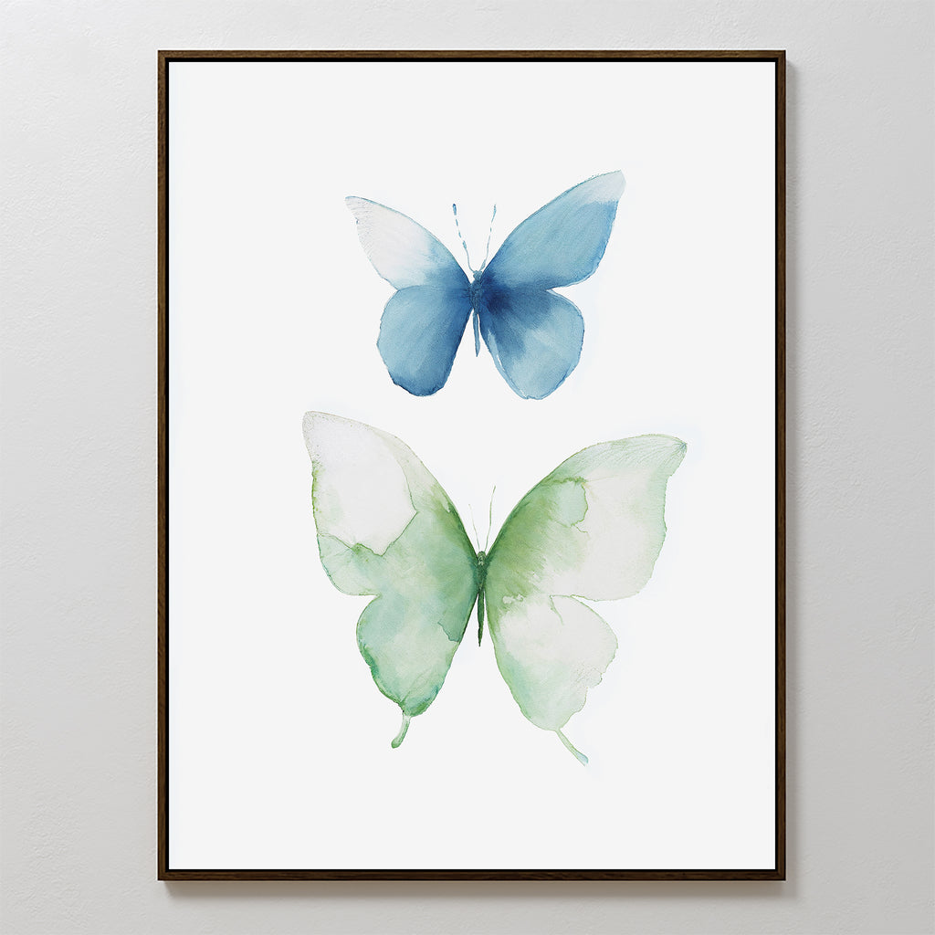The Soft Flight Canvas Art is a framed minimalist wall decor featuring two watercolor butterflies—a blue one above and a larger green one below—on a clean white background.