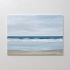 The Soft Tide Canvas Art – Horizontal features a calm beach with gentle waves and a soft blue sky, using muted blues, whites, and sandy beige. It’s perfect minimalist wall art for adding tranquil coastal vibes to your bedroom decor.