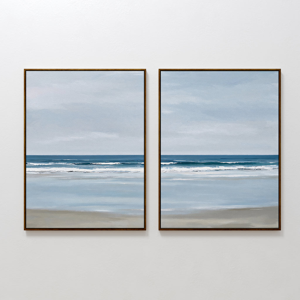 The Soft Tide Set of 2 features framed seascape paintings in soft blues and grays, ideal minimalist wall art to bring serene coastal vibes and enhance your bedroom decor.