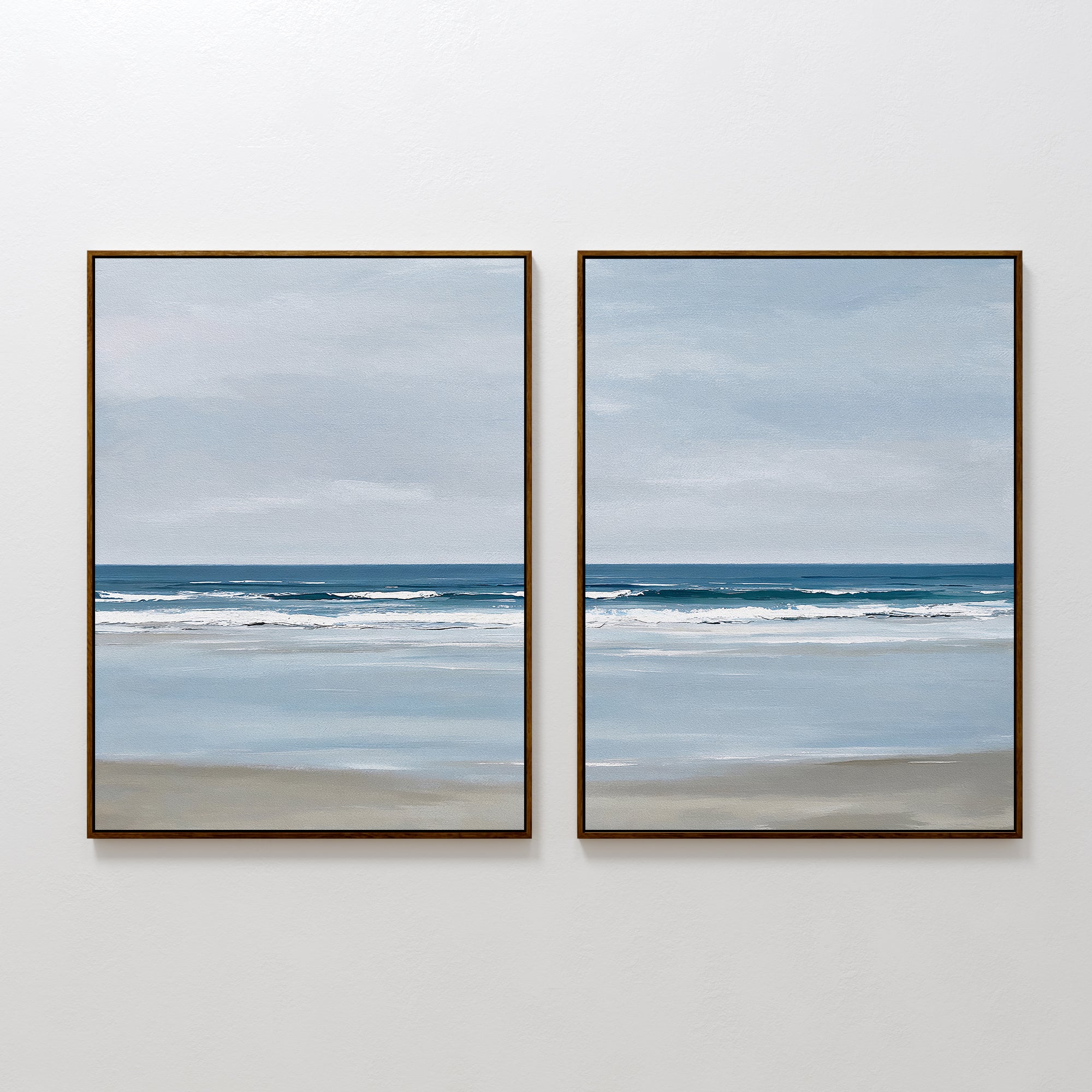 The Soft Tide Set of 2 features framed seascape paintings in soft blues and grays, ideal minimalist wall art to bring serene coastal vibes and enhance your bedroom decor.