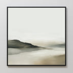 Soft Valley Canvas Art features a minimalist landscape with soft green, beige, and gray tones. Blurred brushstrokes depict rolling hills and a calm water, creating a serene look—perfect for bedroom decor. Black framed for a modern touch.