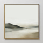 Soft Valley Canvas Art features gentle hills in muted gray, beige, and green reflected in calm water under a pale sky. Framed in a simple wooden frame, its perfect for minimalist or bedroom decor.