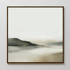 Soft Valley Canvas Art features a minimalist landscape in soft beige, gray, and green tones with hills reflected in calm water beneath a pale sky. Framed in thin dark wood, its perfect for minimalist or bedroom decor.