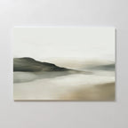 The Soft Valley Canvas Art – Horizontal features a minimalist landscape in soft, muted earth tones, with rolling hills and a pale, cloudy sky—ideal for peaceful wall art or adding serene style to minimalist decor.