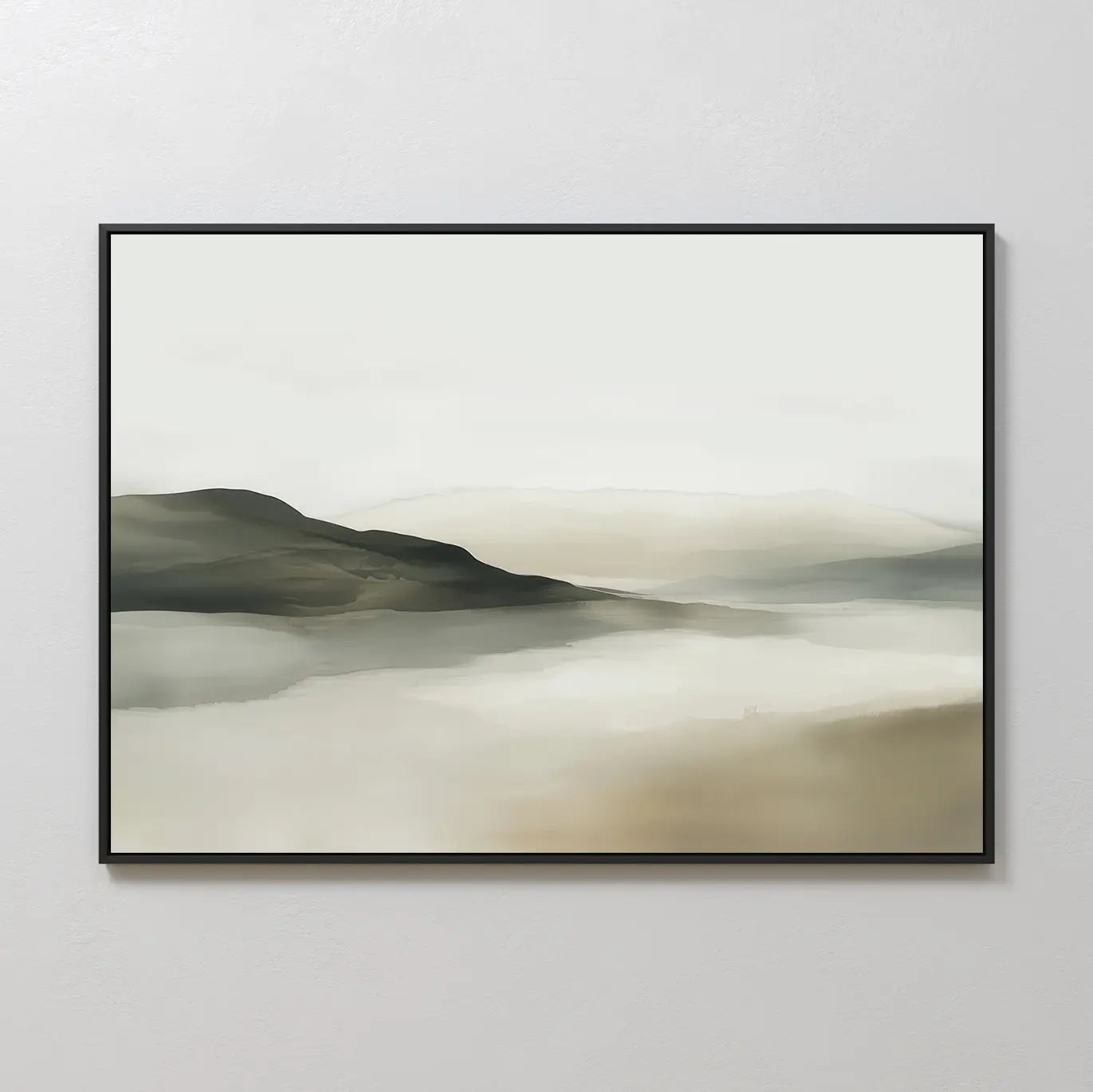 Soft Valley Canvas Art – Horizontal features a serene landscape in soft, muted tones. Gentle hills and distant mountains fade into a misty sky, creating peaceful wall art framed and displayed on a light-colored wall—ideal for minimalist decor.