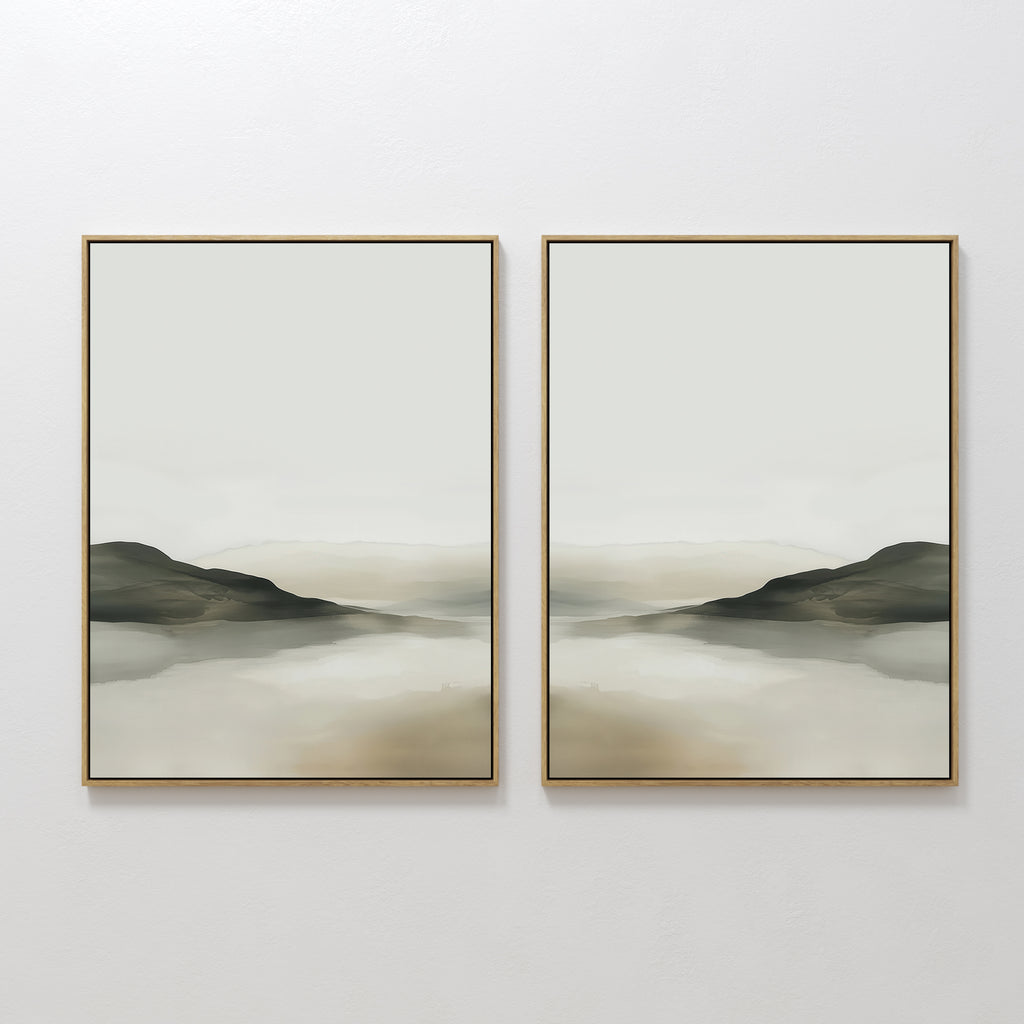The Soft Valley Set of 2 features framed minimalist landscape art in beige, gray, and brown tones—ideal for calm, modern spaces with peaceful depictions of hills and a reflective surface beneath a pale sky.