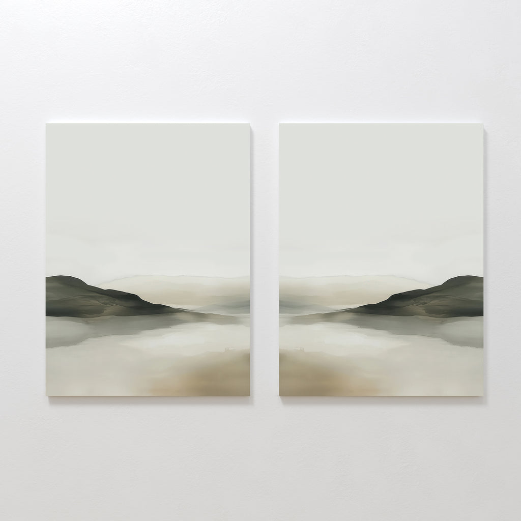 The Soft Valley Set of 2 features minimalist landscape paintings in soft green, beige, and gray tones, depicting distant hills with their reflections—peaceful art ideal for minimalist decor, displayed side by side on a white wall.