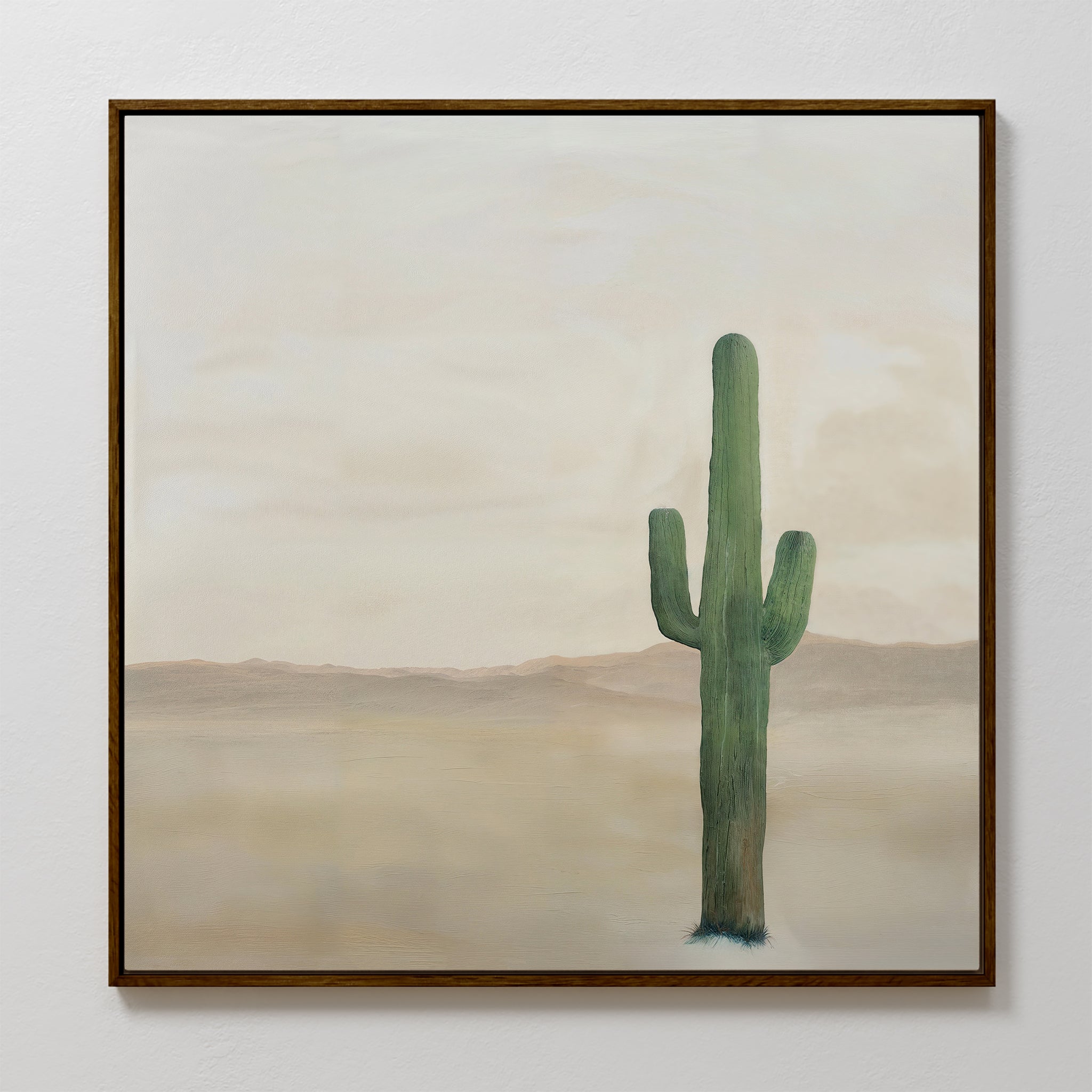 The Solitary Rise Canvas Art features a tall green cactus in a desert landscape with mountains and clouds—ideal for minimalist style or adding character to your living room decor.
