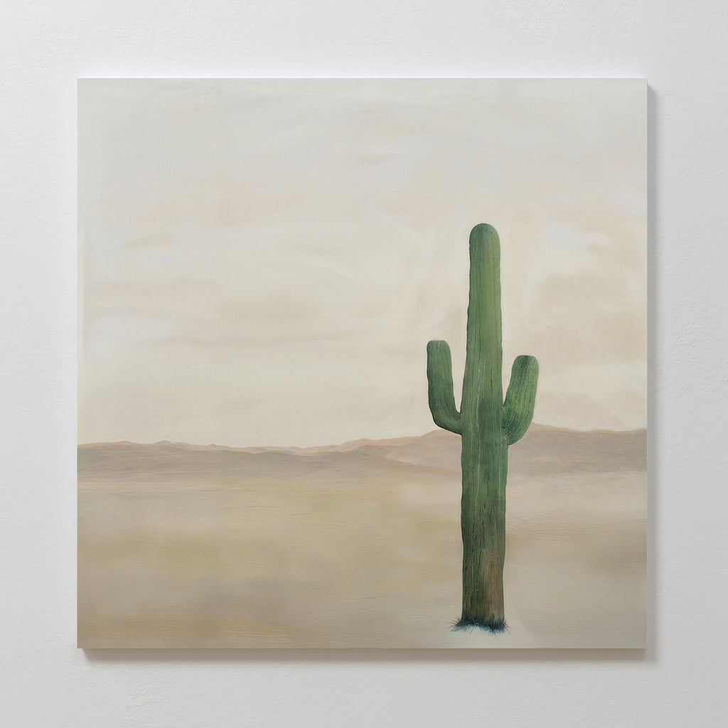 Solitary Rise Canvas Art features a single tall green cactus in a barren desert with hazy mountains and a cloudy sky—ideal for adding calm to your living room or complementing minimalist decor styles.