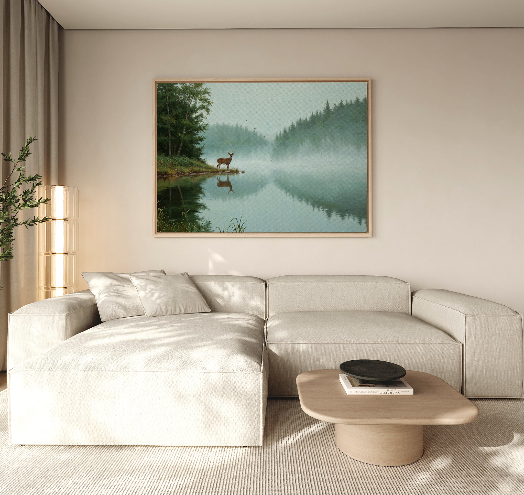 A modern, minimal living room with a light-colored sectional sofa, wooden coffee table, and the Solitude by the Lake Canvas Art, creating serene spaces with peaceful forest and water views.