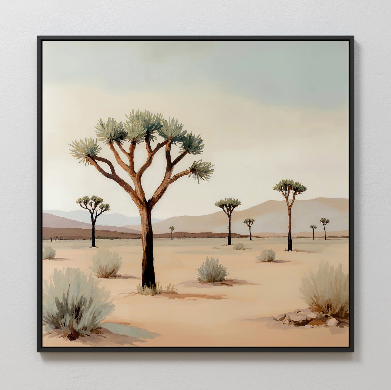 Sparse Growth Canvas Art features a desert landscape with Joshua trees, sparse bushes, and distant mountains under a pale blue sky, adding minimal wall art charm to any light-colored wall.