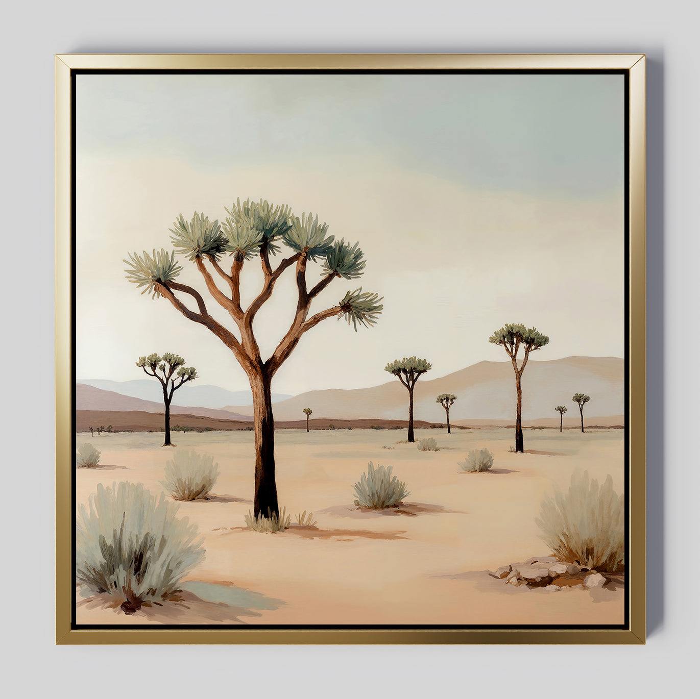 Sparse Growth Canvas Art: A framed painting of a desert scene with Joshua trees, sparse shrubs, and distant mountains under a pale sky. Soft beige sands and muted greens bring minimal, nature-inspired decor to any room.