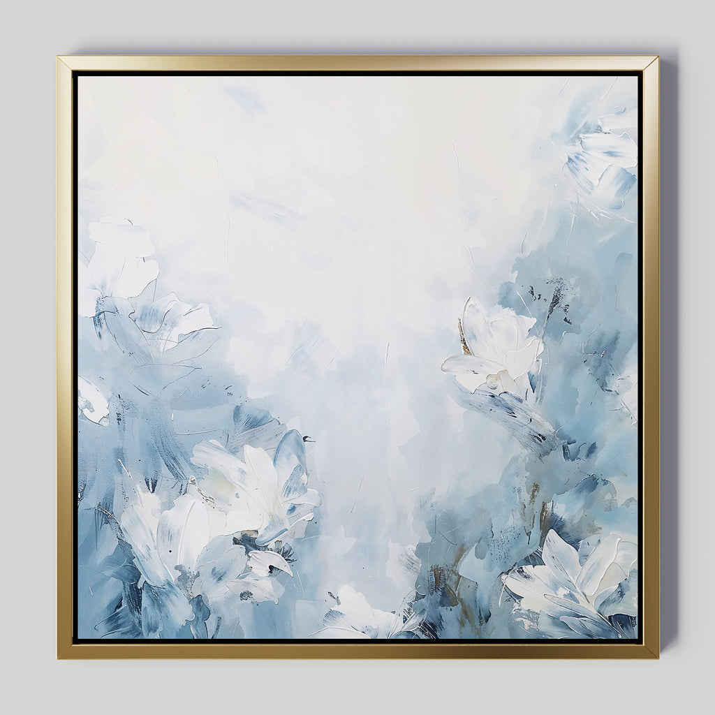Spring Hues Abstract Canvas Art features soft blue and white floral shapes with gentle brushstrokes. The elegant gold frame contrasts the delicate colors, creating a calm, airy atmosphere for your space.