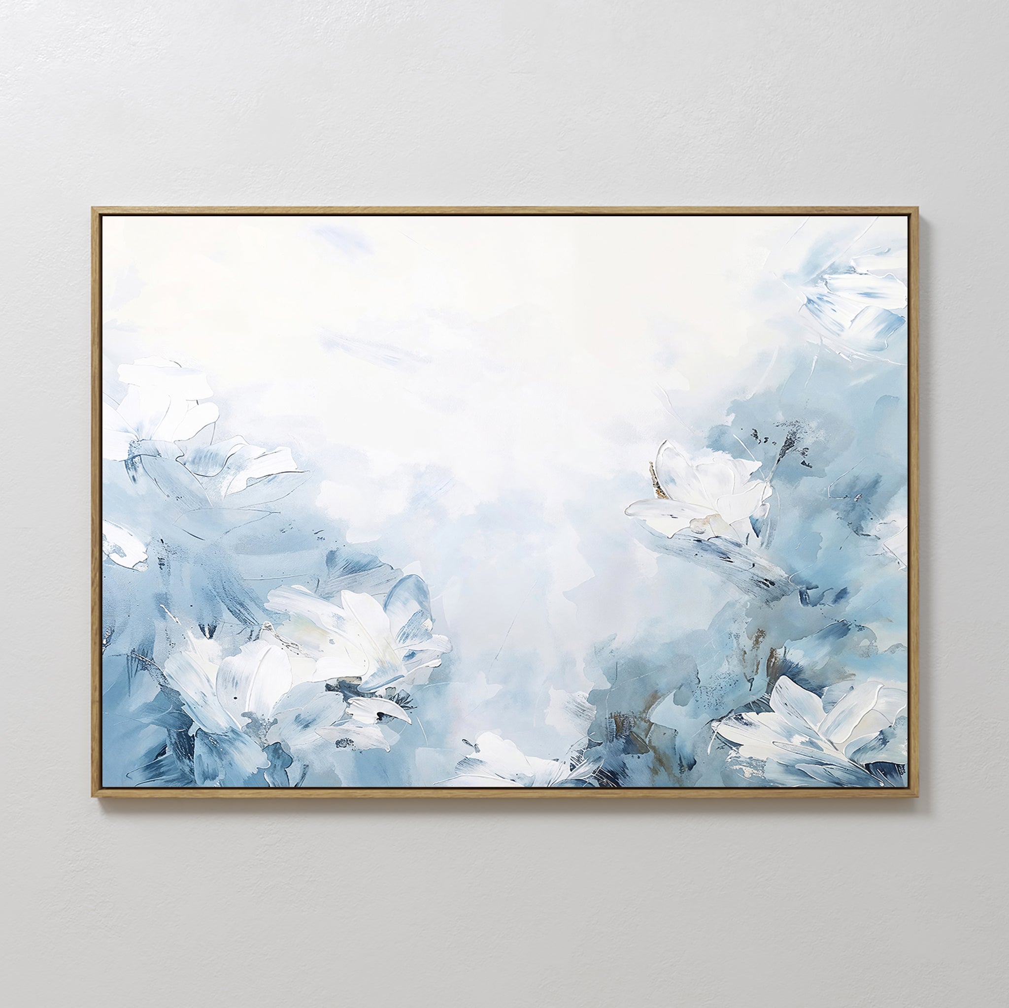 Spring Hues Canvas Art – Horizontal features a framed abstract design in soft blue and white, depicting dreamy flowers on a light background, adding a calming, modern touch to your living room decor.