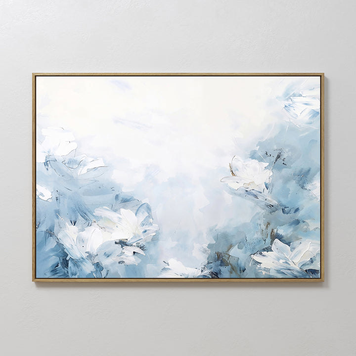Spring Hues Canvas Art – Horizontal features a framed abstract design in soft blue and white, depicting dreamy flowers on a light background, adding a calming, modern touch to your living room decor.
