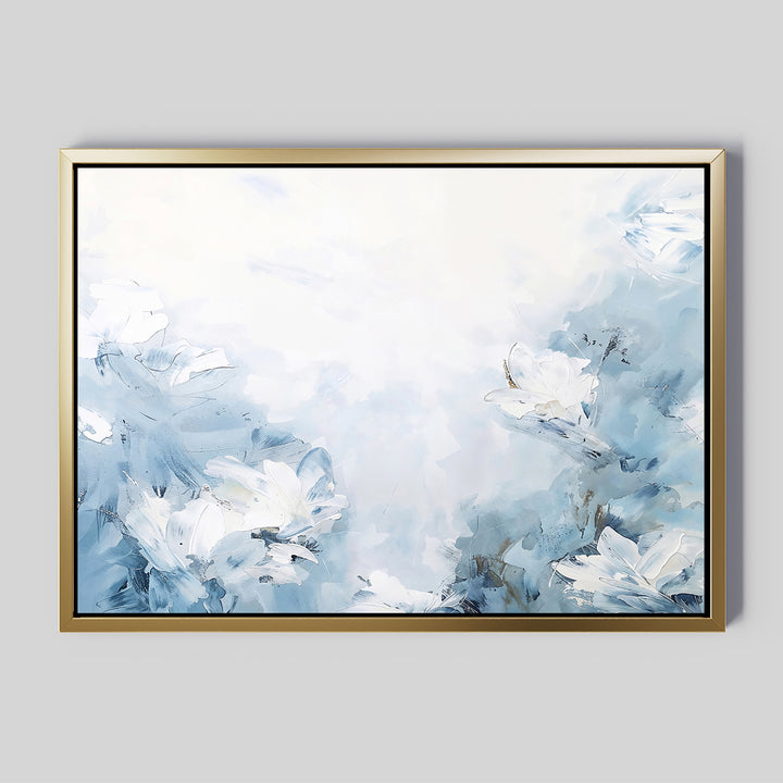 The Spring Hues Canvas Art – Horizontal features white and blue abstract flowers on a light blue and white backdrop, framed in thin gold. This minimalist piece adds a serene, airy feel to your modern living room decor.