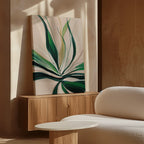 A modern room with beige walls features the Springs Essence Abstract Canvas Art above a wooden sideboard. Nearby, a white textured sofa and a round table sit in natural light, creating a serene Nordic Park-inspired atmosphere.