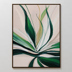 Springs Essence Abstract Canvas Art showcases abstract, flowing green leaves on a beige background. This minimalist piece comes framed in a slim black frame and is ideal for mounting on a white wall.