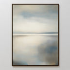 The Still Horizon Canvas Art features a minimalist shoreline in soft neutrals, with a calm, blurred seascape and hazy horizon under cloudy skies. Blue and beige tones evoke tranquility, all framed in a thin, dark border.
