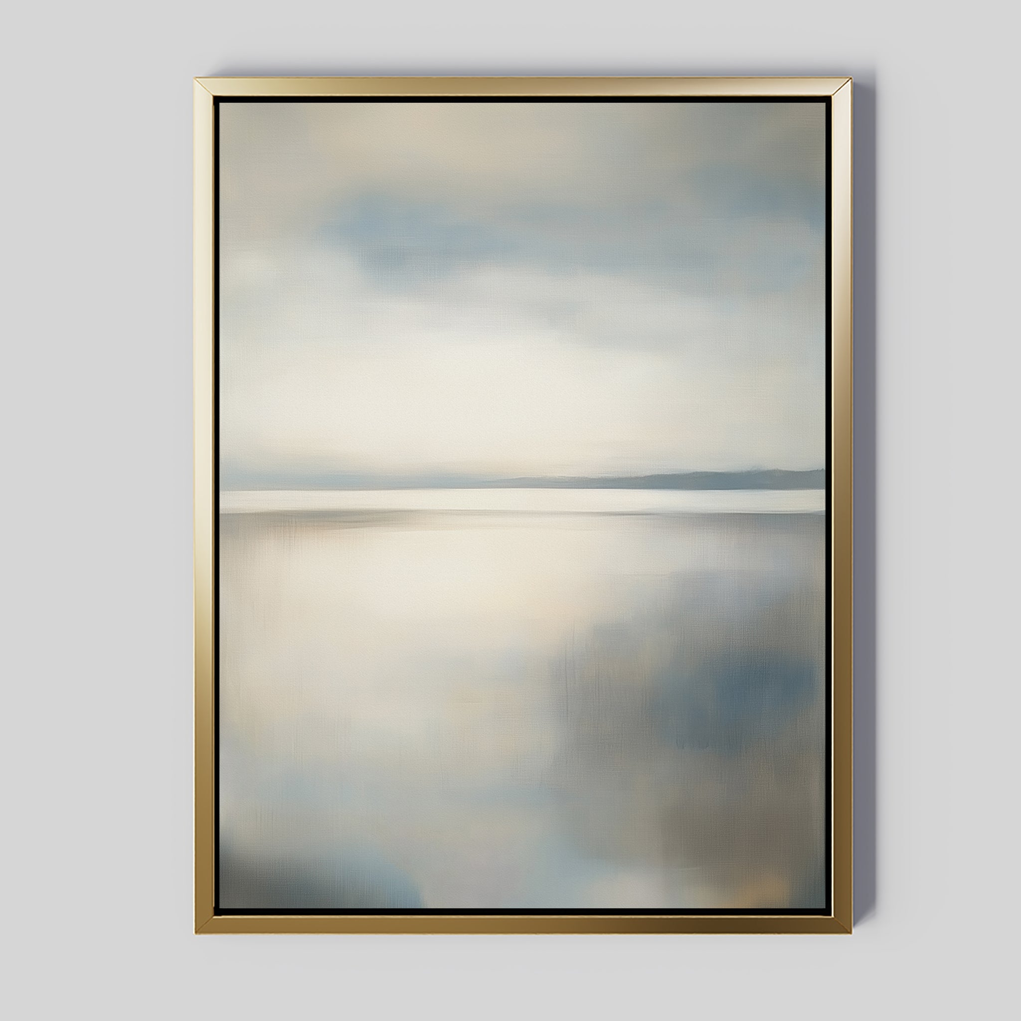 Still Horizon Canvas Art: a serene shoreline print with a minimalist landscape in soft blue, gray, and beige hues. Calm water reflects a cloudy sky, all framed in gold with a thin black inner border—perfect minimalist wall art.