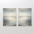The Still Horizon Set of 2 features abstract landscape paintings with soft blue, gray, and beige tones, evoking a serene shoreline and minimalist vibe—ideal wall art for creating a calm, reflective atmosphere in your space.