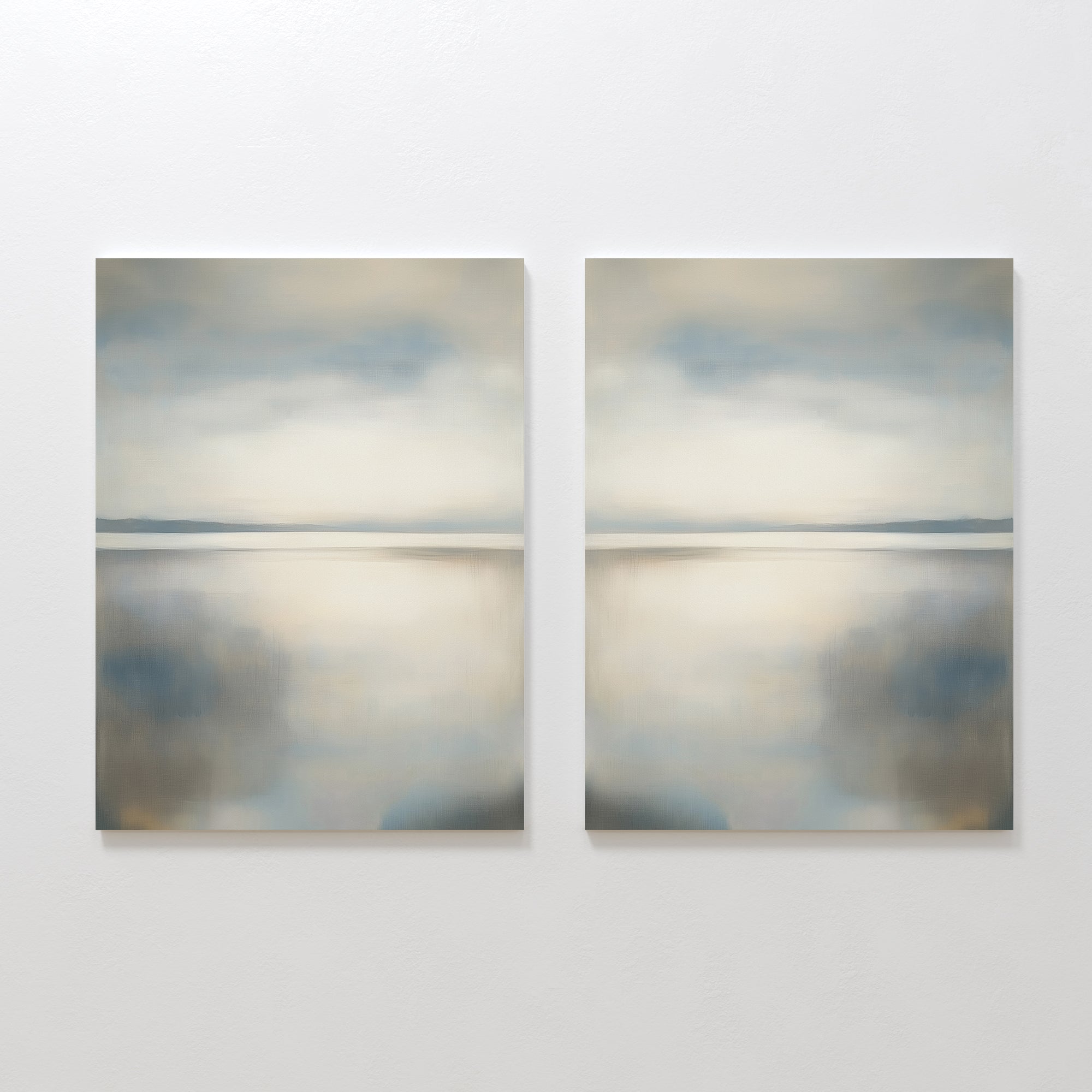 The Still Horizon Set of 2 features abstract landscape paintings with soft blue, gray, and beige tones, evoking a serene shoreline and minimalist vibe—ideal wall art for creating a calm, reflective atmosphere in your space.