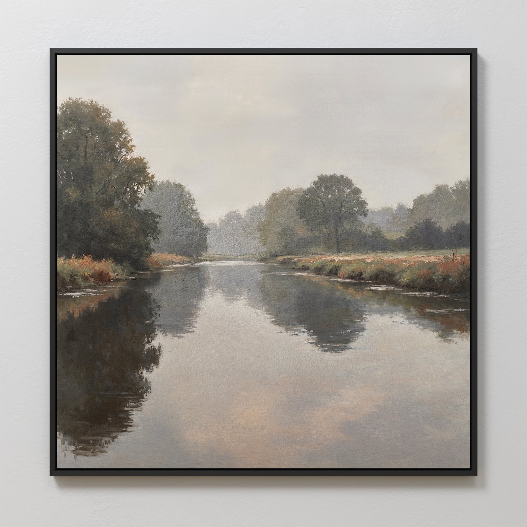 The Still Riverbank Canvas Art features a peaceful river mirroring trees and clouds, with lush greenery along the banks—an ideal framed piece for bedroom decor that adds a soft, serene touch to any space.