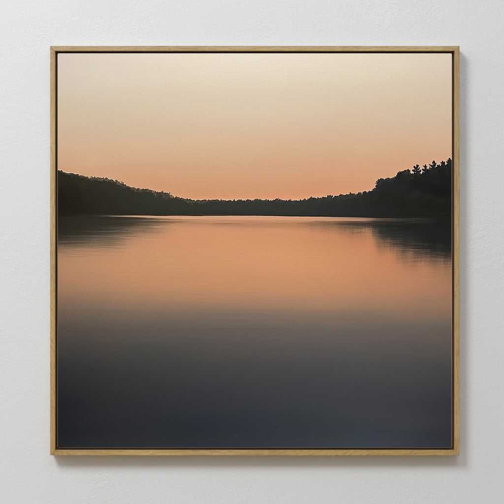 Still Waters Canvas Art showcases a tranquil lake at sunset, with orange and pink hues reflecting on the water and dark tree silhouettes—perfect peaceful wall art for your living room décor.