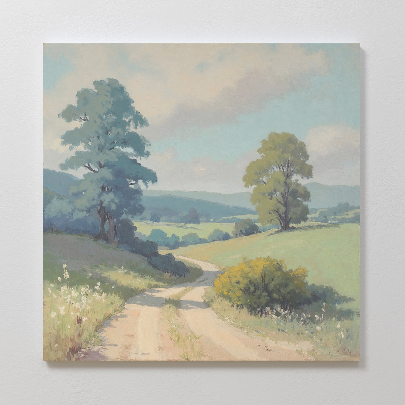 Bring Nordic Park charm to any space with the Summer Dale Canvas Art—featuring a countryside scene of winding road, grassy hills, wildflowers, and two large trees beneath a blue sky with soft clouds.