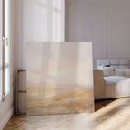 The Sunlit Meadows Abstract Canvas Art leans against the wall of a bright, minimalist living room with parquet floors and neutral furniture, sunlight pouring through tall windows—ideal for anyone looking to add serene inspiration to their decor.