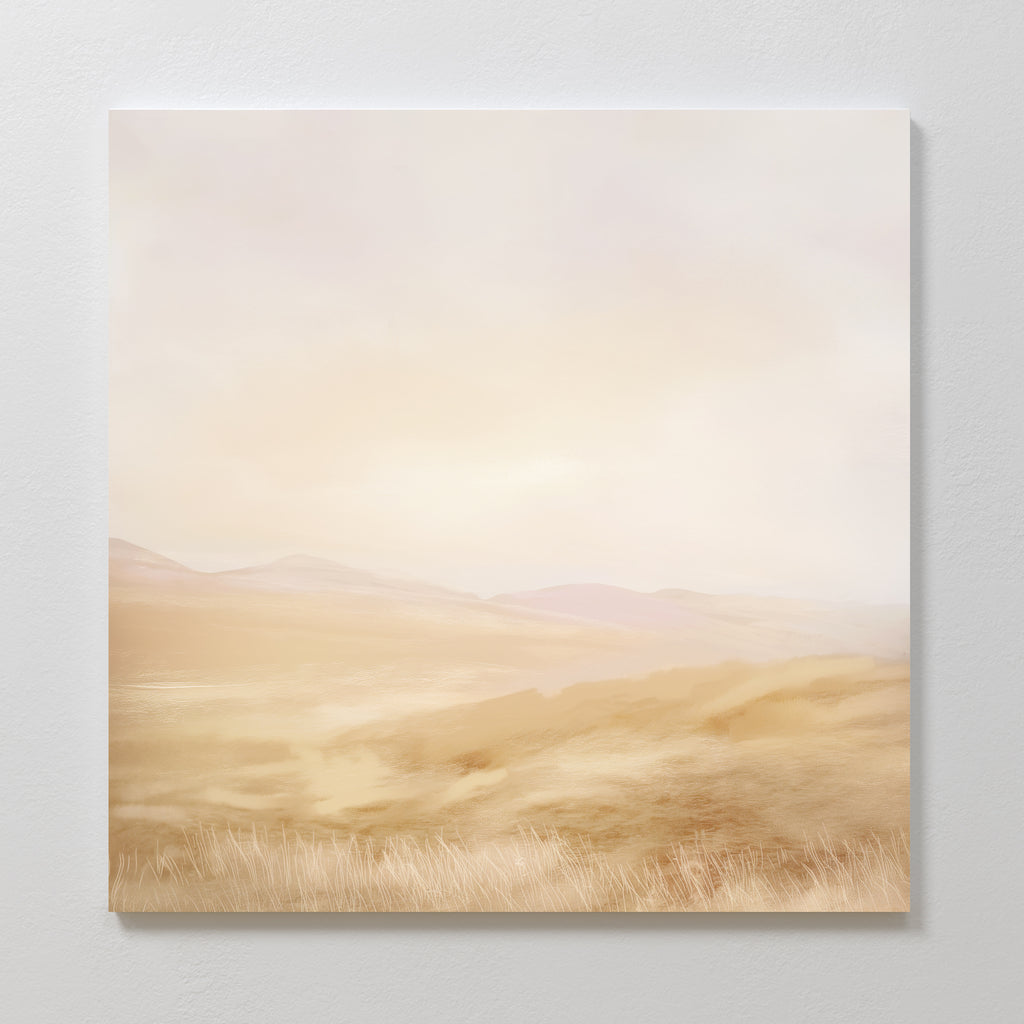 The Sunlit Meadows Abstract Canvas Art, featuring soft beige and light brown tones with distant hills and fields under a hazy sky, brings serene elegance to any space when displayed on a light-colored wall.