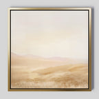 Sunlit Meadows Abstract Canvas Art features a soft, hazy landscape in warm beige and light brown with distant hills under a pale sky. A thin metallic gold frame completes the elegant look, perfect for adding warmth to any space.