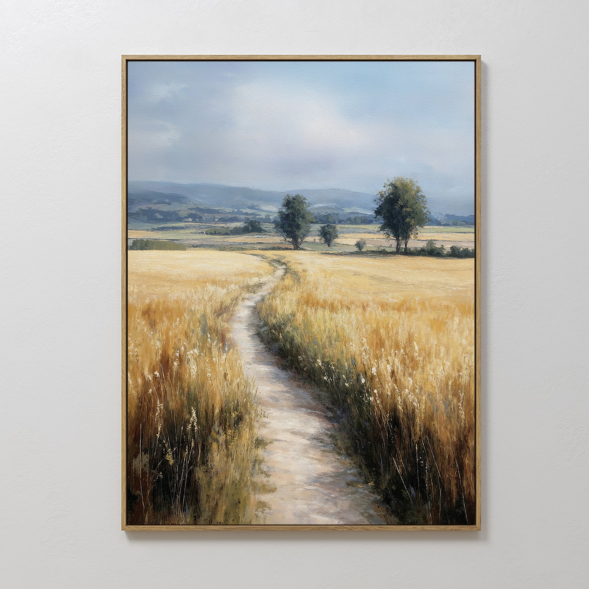 The Sunlit Passage Canvas Art features a nature-inspired scene of a country path through golden fields and wild grasses, under a partly cloudy sky—ideal as large wall art for any space.