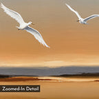 A close-up of the Sunset Flight Canvas Art shows two white birds soaring over a serene, warm-toned landscape in orange, peach, and brown—perfect minimalist wall decor. "Zoomed-In Detail" is written in the lower left corner.