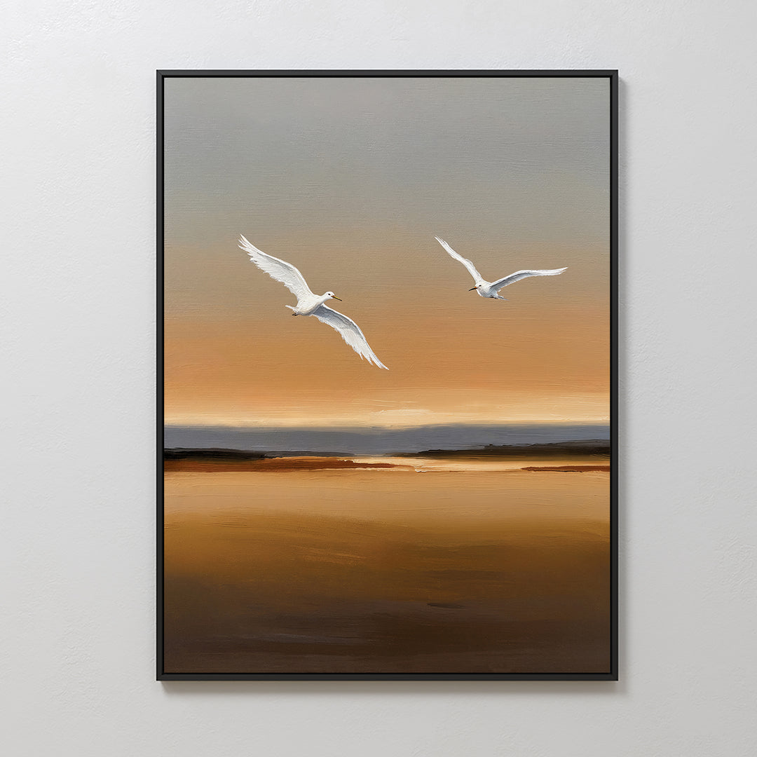 Sunset Flight Canvas Art features two white birds soaring over a tranquil brown and orange landscape with a muted sky—ideal minimalist wall art to elevate your bedroom decor.