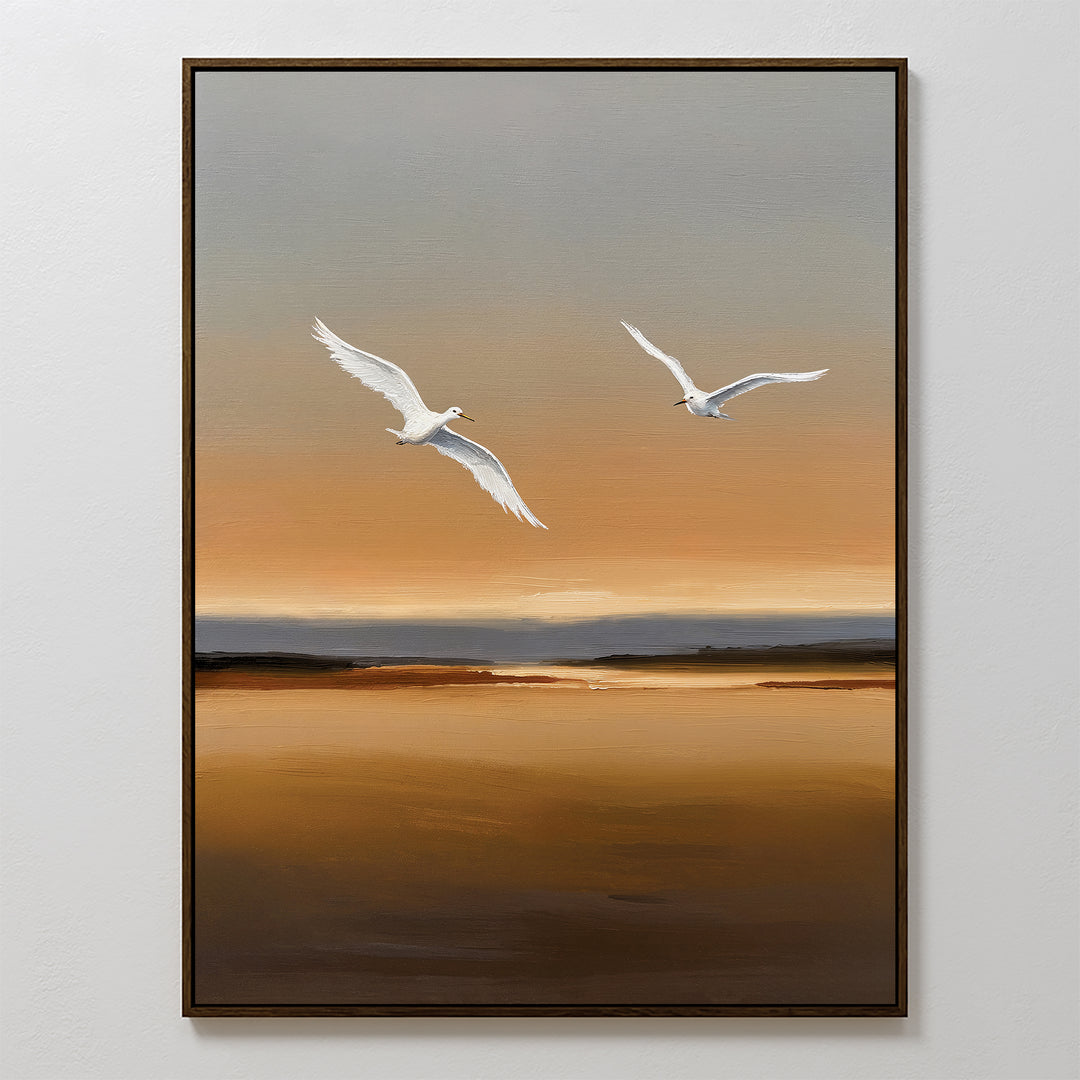 Sunset Flight Canvas Art features two white birds soaring above a tranquil brown and orange landscape at sunset. This framed modern wall art brings peaceful elegance and style to any bedroom decor.