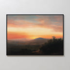 The Sunset Reflection Canvas Art features a framed serene landscape of rolling hills, a glowing orange-pink sunset sky, distant mountains, and shadowy trees—ideal vintage wall decor for any room.