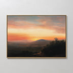 Sunset Reflection Canvas Art features a framed serene landscape with a colorful sunset sky, distant mountains, trees, and a winding path—perfect sunset wall art for any plain white wall.