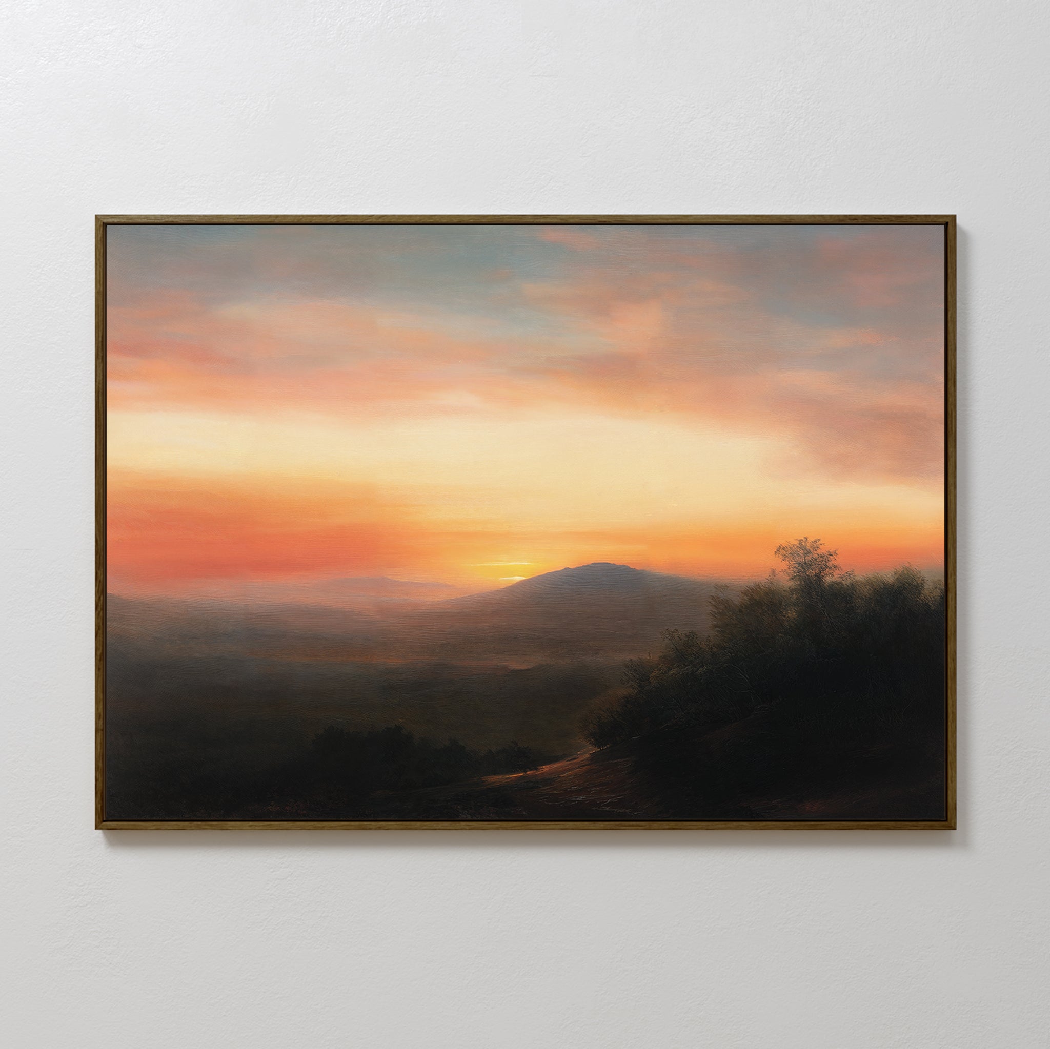 Sunset Reflection Canvas Art: A framed wall decor featuring a serene landscape with distant hills in warm orange and pink hues, and a dark foreground of trees—perfect vintage-inspired artwork for any space.