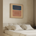 A beige bedroom features a cream upholstered bed with white pillows. Above the headboard hangs the Sunset Vapor Canvas Art, showcasing blurred blue and red rectangles. A bare branch decorates the bedside table.