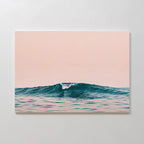 Sunset Wave Canvas Art showcases a minimalist blue ocean wave set against a calm light pink sky. This elegant coastal wall art adds subtle beach-inspired decor and serene charm to any room.