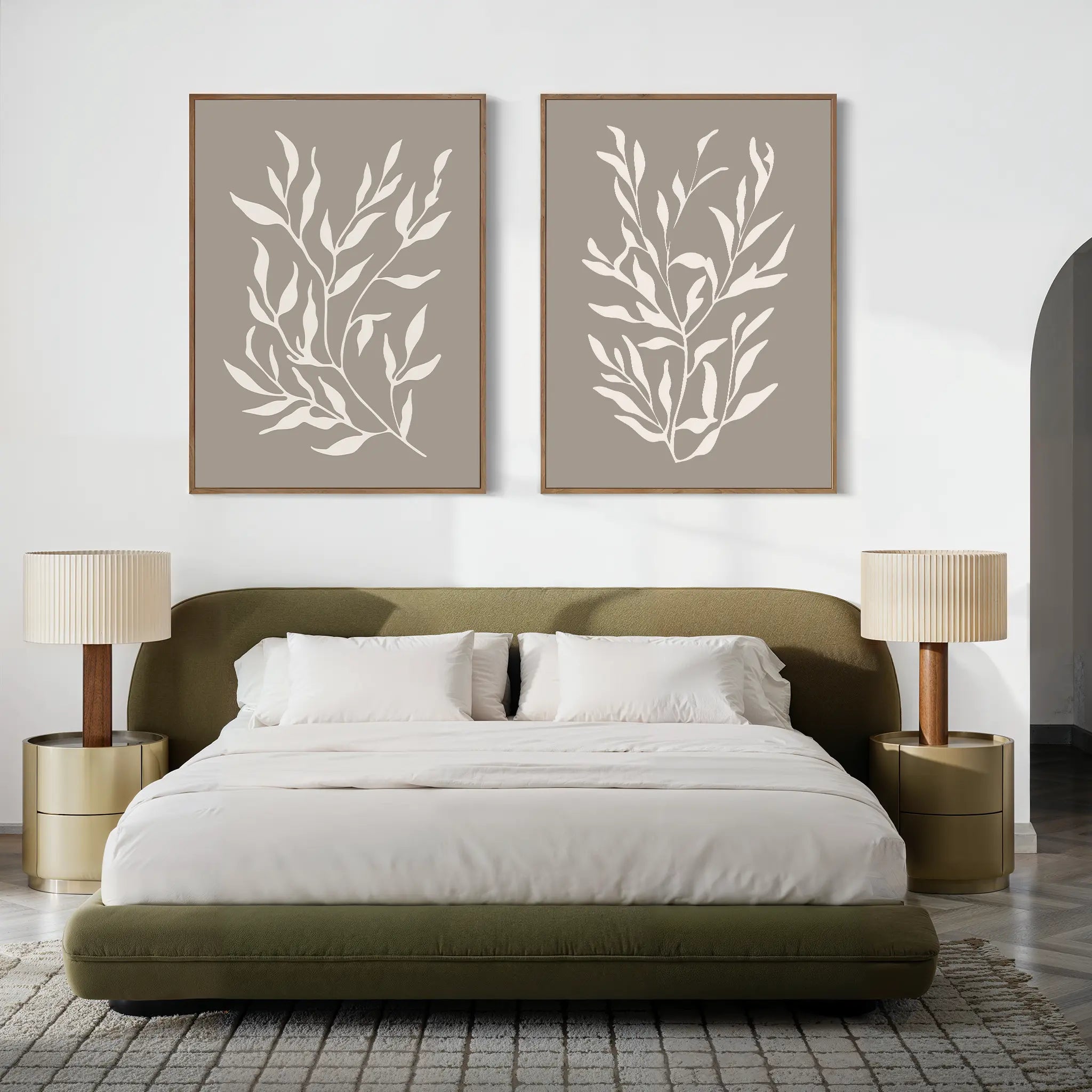 A modern bedroom featuring a green upholstered bed, white bedding, beige nightstands with matching lamps, and the Taupe Botanical Set of 2 prints above the bed—perfect for contemporary interior enthusiasts.
