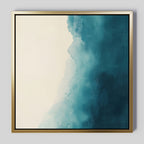 Teal Tide Canvas Art features a gold-framed abstract design with a gradient from off-white to deep teal, showcasing soft, cloudy blending and textured brushstrokes for a modern statement.